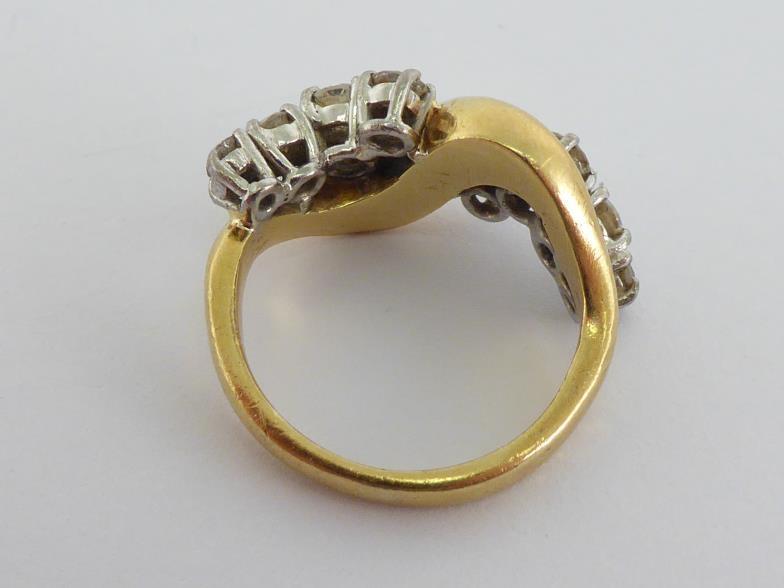 An 18 carat gold and diamond dress ring, the undulating bezel set either side with graduated - Image 4 of 6