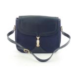 A vintage Gucci monogrammed navy canvas and leather handbag with goldtone horsebit closure, probably