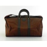 A vintage Fendi S.A.S monogrammed travel bag with leather accents. Labelled inside Fendi S.A.S ROMA,