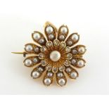 A late Victorian split pearl (untested) and diamond brooch/pendant, the three tiered flower spray