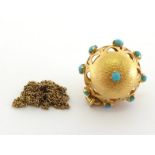 A yellow metal (tests 18 carat gold) and turquoise pendant, the open work globe set overall with