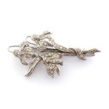 A diamond brooch, designed as a posy of snowdrops, pave set overall with single cuts, mounted in