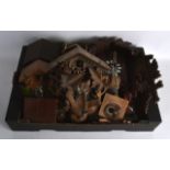 A GROUP OF FIVE BLACK FOREST BAVARIAN CUCKOO CLOCKS of various forms and sizes. (qty)