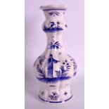 A FRENCH FAIENCE TYPE TIN GLAZED LOBED POTTERY VASE painted with Chinese figures within