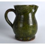 A FARNHAM POTTERY GREEN GLAZED JUG. 6.5ins high.