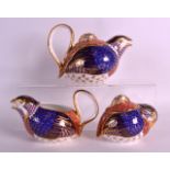 AN UNUSUAL ROYAL CROWN DERBY THREE PIECE 'QUAIL' TEASET painted in imari tones with naturalistic