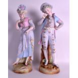 A VERY LARGE PAIR OF 19TH CENTURY CONTINENTAL BISQUE PORCELAIN FIGURES modelled upon naturalistic