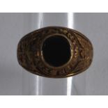 A US MILITARY NAVAL RING inset with a black stone.