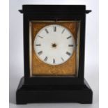 A MID 19TH FRENCH EBONISED SMALL MANTEL CLOCK with white enamel dial, engraved with flowers. 6.75ins