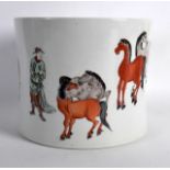 A CHINESE FAMILLE VERTE PORCELAIN BRUSH POT painted with a male and eight horses in various stances.