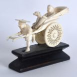 AN EARLY 20TH CENTURY CHINESE CARVED IVORY RICKSHAW supported upon a fitted hardwood base. Ivory