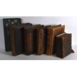 A GROUP OF FIVE VICTORIAN LEATHER BOUND PHOTOGRAPH ALBUMS some with photographs, together with a