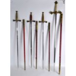 A SET OF FOUR 19TH CENTURY MASONIC SWORDS of various forms and sizes. Largest 3ft 3ins long. (4)