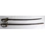 TWO MID 19TH CENTURY MILITARY SABRES with pierced brass guards and steel blades. 3Ft 3ins long. (2)