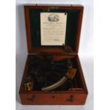 A BOXED 19TH CENTURY ENGLISH H HUGHES & SON LTD SEXTANT with fittings. Sextant 8.5ins wide.