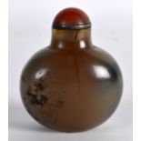 AN EARLY 20TH CENTURY CHINESE CARVED AGATE SNUFF BOTTLE AND STOPPER of pale greyish hue with