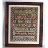 A 19TH/20TH CENTURY FRAMED IRISH SAMPLER. 1Ft x 1ft 4ins.