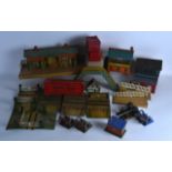 A COLLECTION OF VINTAGE HORNBY MECCANO TINPLATE BUILDINGS including stations, platforms etc. (qty)