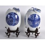 A FINE PAIR OF MID 19TH CENTURY CHINESE BLUE AND WHITE VASES bearing Yongzheng marks to base,