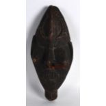 AN EARLY 20TH CENTURY PAPUA NEW GUINEA SEPIK CARVED MASK. 11.5ins long.