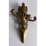 A GOOD 18TH/19TH CENTURY TIBETAN GILT BRONZE PHURBA RITUAL DAGGER formed with mask heads. 5.25ins