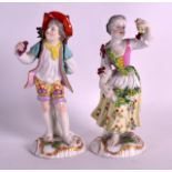 A PAIR OF 19TH CENTURY CONTINENTAL PORCELAIN FIGURES depicting a young boy and female upon scrolling