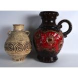 TWO LARGE RETRO GERMAN POTTERY JUGS/VASES one decorated with flowers, the other with swirling
