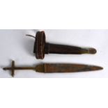 AN ANTIQUE TAUREG TELEK BRASS CRUCIFORM GRIP ARM DAGGER North African. 1Ft 3.5ins long.