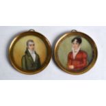 A PAIR OF 18TH/19TH CENTURY CONTINENTAL IVORY MINIATURES painted with a male and female, within gilt