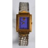 A GIANNI VERSACE GOLD PLATED WRISTWATCH with puce dial. 1.25ins wide.