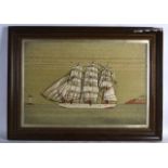 A LARGE VICTORIAN FRAMED WOOLWORK MARITIME EMBROIDERY depicting a boat in full sail before a partial