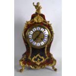 A 19TH CENTURY FRENCH BOULLE AND GILT METAL MANTEL CLOCK with cupid mounts, decorated with