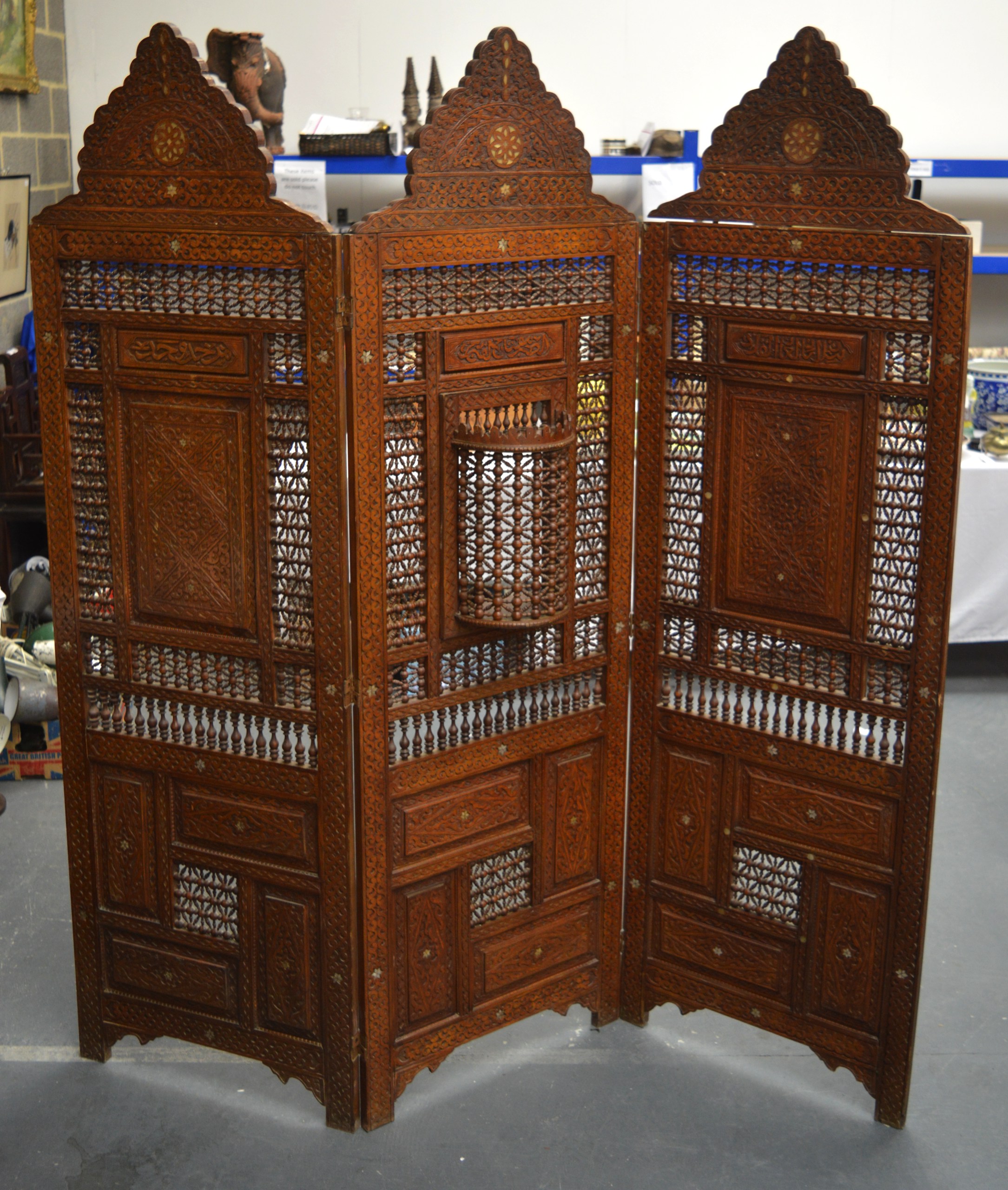 A VERY LARGE LIBERTY'S ISLAMIC INSPIRED WOODEN SCREEN decorated with calligraphy and mother of pearl
