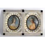 A CASED PAIR OF EARLY 20TH CENTURY PAINTED PORTRAIT IVORY MINIATURES within ivory frames.