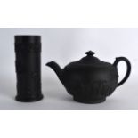 A 19TH CENTURY WEDGWOOD BLACK BASALT TEAPOT AND COVER decorated in relief with classical figures,