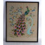 AN EARLY 20TH CENTURY FRAMED EMBROIDERY depicting birds and flowers. 1Ft 4ins x 1ft 8ins.