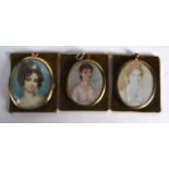 A GROUP OF THREE 19TH CENTURY PAINTED PORTRAIT IVORY MINIATURES. (3)