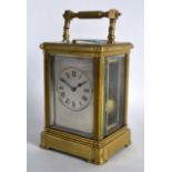 AN EARLY 20TH CENTURY BRASS REPEATING CARRIAGE CLOCK with silver dial, signed Edwards & Son of