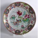 AN EARLY 18TH CENTURY CHINESE EXPORT FAMILLE ROSE DISH Yongzheng, painted with two ducks swimming.