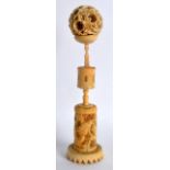 A 19TH CENTURY CHINESE CANTON CARVED IVORY PUZZLE BALL ON STAND with dragon stem and incised