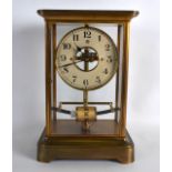 AN EARLY BULLE BATTERY REGULATOR MANTEL CLOCK with brass case and black numerals. 1Ft 1ins high.