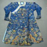 A HUGE 19TH CENTURY CHINESE BLUE SILKWORK DRAGON ROBE decorated with clouds, crashing waves and