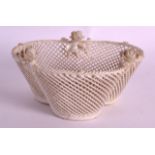 AN IRISH BELEEK PORCELAIN TREFOIL SHAPED BASKET. 5.5ins wide.