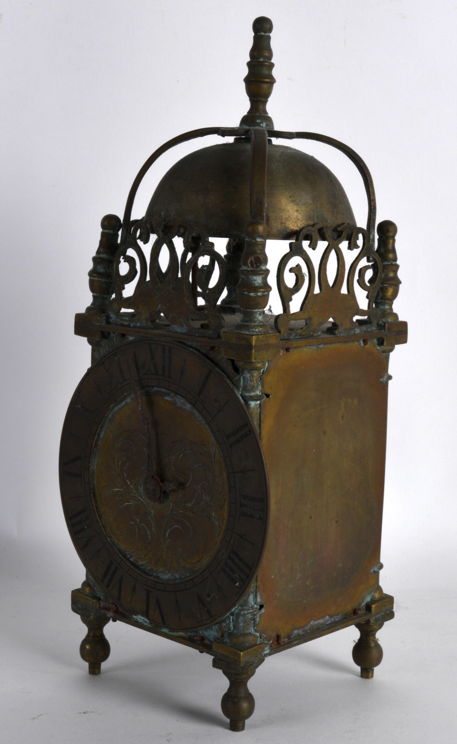 A VICTORIAN BRASS LANTERN CLOCK in the 17th Century style, the dial engraved with foliage and