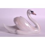 A ROYAL COPENHAGEN PORCELAIN FIGURE OF A SWAN. 6.75ins wide.