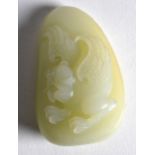 A CHINESE CARVED JADE BOULDER decorated with a mythical beast. 2.75ins long.