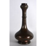 A CHINESE QING DYNASTY BRONZE GARLIC NECK VASE of bulbous form with ring around neck. 9.25ins high.