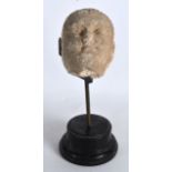 AN EARLY CARVED STONE HEAD OF A MALE possibly Indian or Cambodian. Head 4.25ins x 3.25ins.