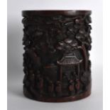 A GOOD 19TH CENTURY CHINESE CARVED BAMBOO BRUSH POT decorated with figures within extensive