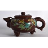 AN UNUSUAL CHINESE ENAMELLED YIXING POTTERY TEAPOT AND COVER painted with flowers. Signed. 6.5ins